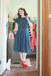 vintage blue dress, pink buttons, red shoes