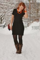 Black dress with orange jewellery