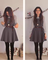 Patterned blouse, pinafore dress & shiny shoes.