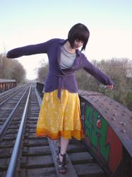 Sunny skirt, somber top.