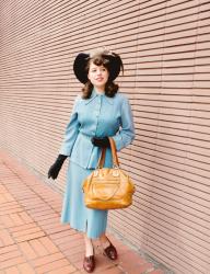 Blue suit and feathered hat