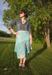 Finding the right match: denim shirt and breezy skirt.