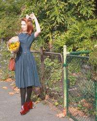 vintage blue dress with pink buttons and a peter pan collar