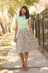 A rounded collar and a floral skirt