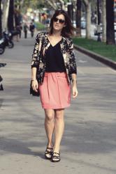 Pink skirt, flowery jacket.