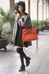 Furry hat and orange bag