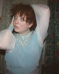 Cinderella blouse with no makeup and a wooden bird