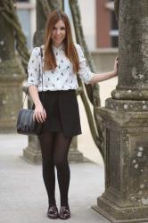 Asymmetric skirt and parrots shirt