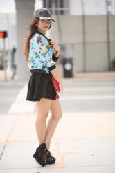 Floral bomber and leather cap....