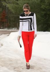 Colorblocked sweater and red crop pants