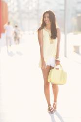 White shorts and yellow pastel blouse