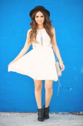 White dress...blue wall....