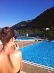 swimming in a lake surrounded by mountains