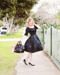 black vintage full skirted dress, stripes, and a touch of gold