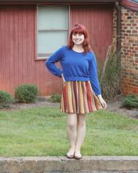 Cobalt Blue Sweater Over a 70s-Colored Chevron Dress