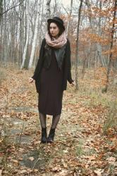 wearing: long dress and a faux leather vest