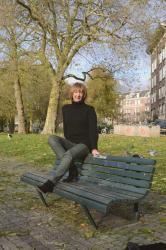 Green coated skinnies, black sweater and black suede boots