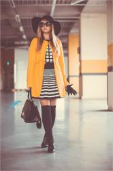Yellow coat and black accessories