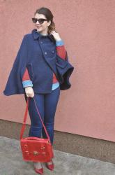 A cape coat, a double denim & a red bag