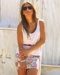 Nemea under the sun / Simple white top with short floral skirt and red belt