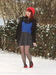 Blue Sweater over a Striped Dress, Red Knit Hat, Fishnet Tights, & Red Moccasins