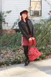 Plaid Dress under a Black Sweater with a Black Beret, Leather Jacket, & Red Camera Bag