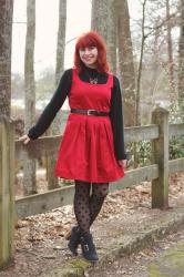 Red Dress over a Black Mock Turtleneck Sweater, Polka Dot Tights, & a Bow Necklace
