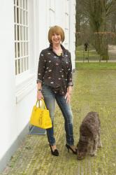 Eye blouse worn on skinny jeans