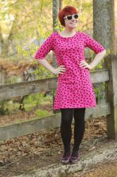 Pink Mustache Print Shift Dress, Pink & Black Kitten Heels, & Polka Dot Sunglasses