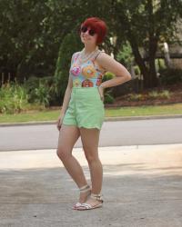 Outfit: Donut Print Bodysuit with Light Green Shorts, White Sandals, & Pink Sparkly Sunglasses