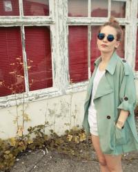 Swan Cap & Green Trench Coat