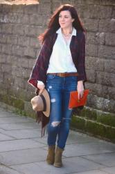 Blanket wrap casually styled with jeans and a blouse