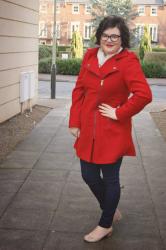 Skinny jeans and a red coat...