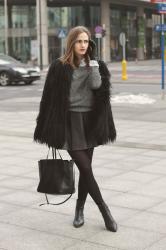 Grey cashmere sweater and leather skirt
