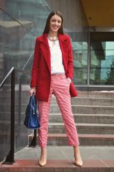 red gingham trousers and navy blue handbag