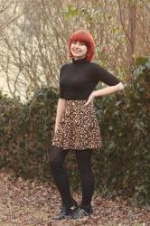 Outfit: Black Turtleneck T-shirt, Leopard Print Skater Skirt, and Heart Print Tights