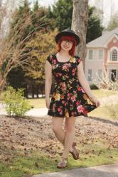 Outfit: Black Floral Skater Dress with Back Cutouts and a Black Boater Hat