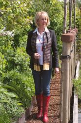 Red cowboy boots with a red tassle necklace