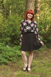 Work Outfit: Black Pleated Skirt, Floral Print Blouse, and Mary Jane Heels