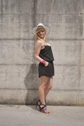 OUTFIT: BLACK ROMPER, PANAMA HAT AND RED BAG