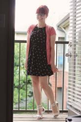 Work Outfit: Bow Print Dress, Pink Short Sleeved Cardigan, White Sandals, and a Bouffant