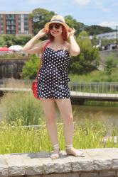 Outfit: Strapless Polka Dot Romper, White Sandals, Aviators, and a Summer Hat