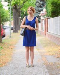 A Dark Blue Dress and Old Shoes
