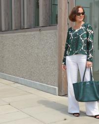 White trousers and a green blouse for late summer