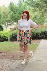 Outfit: White Mock Neck Top, Colorful Star Trek Skirt, and White Sandals