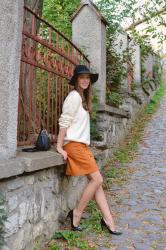 suede front button skirt with beige sweater