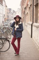 Outfit: burgundy hat with shearling biker coat