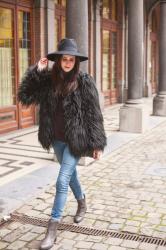 Outfit: shaggy faux fur coat, wide brim hat