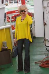 Flared jeans with yellow sweater