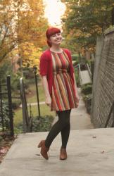 Outfit: Fall-Colored Chevron Dress, Dark Green Tights, and a Red Short Sleeved Cardigan